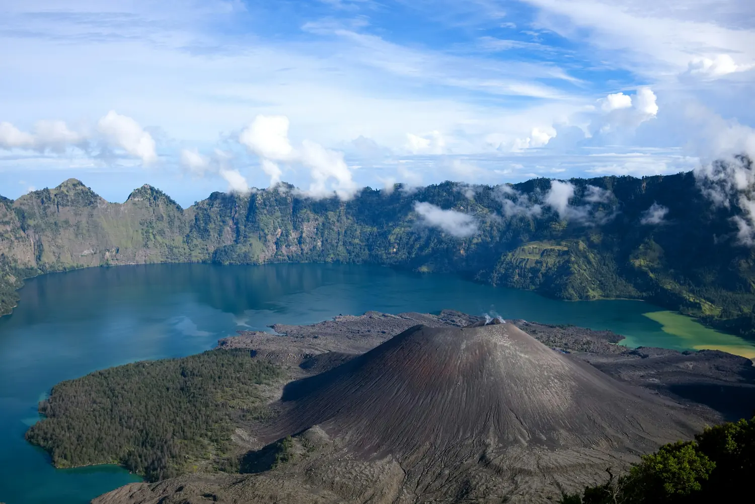 Segara Anak crater lake and the Barujari cone seen from the rim of Mount Rinjani